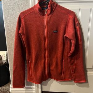 Rust colored Patagonia zip up sweater